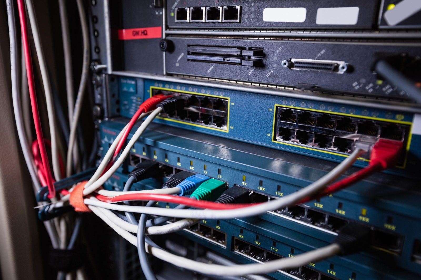 Business network switch and cables in a Durham Region office. Microsoft, Cisco, and IT vendors used by Full Spectrum in Oshawa.